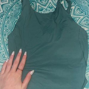 lululemon wonder train racer back tank top size 0 in forest green.